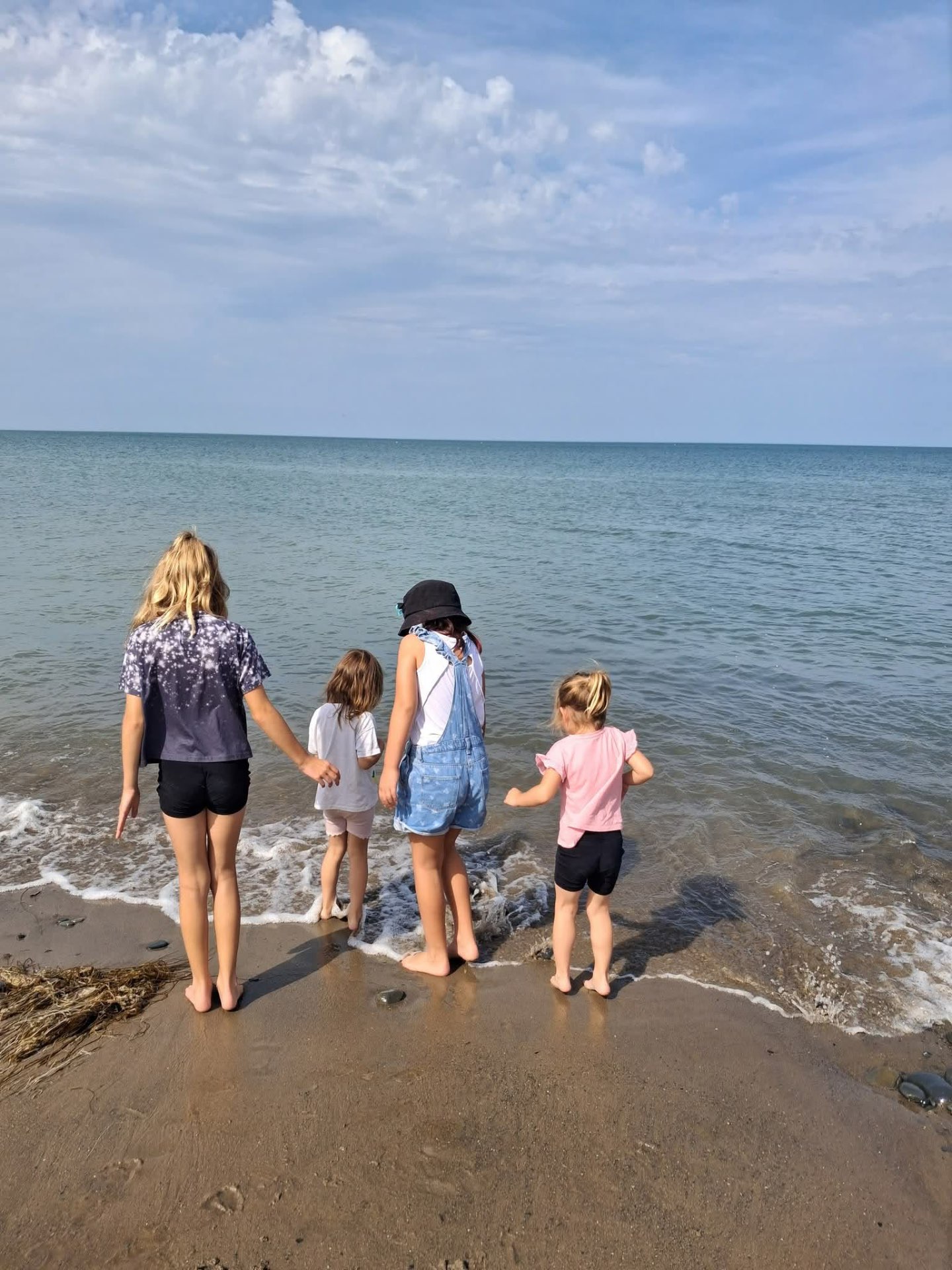 Children paddling at the edge of the sea